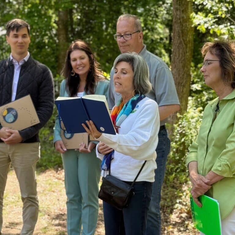 Community ribbon cutting ceremony for the Plymouth Seaside Grace Trail, bringing people together to promote mental health and community well-being.