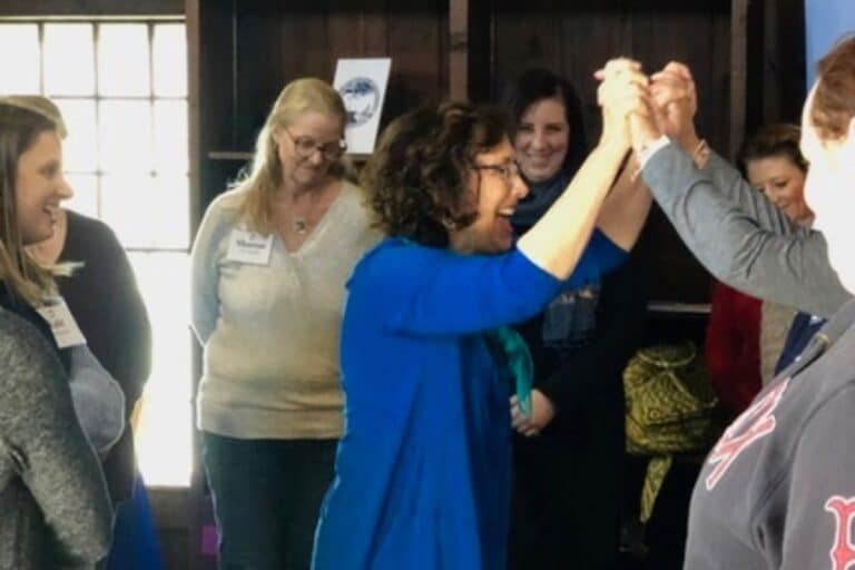 Anne Jolles guiding a corporate team through the Grace Trail for employee wellness and reflection